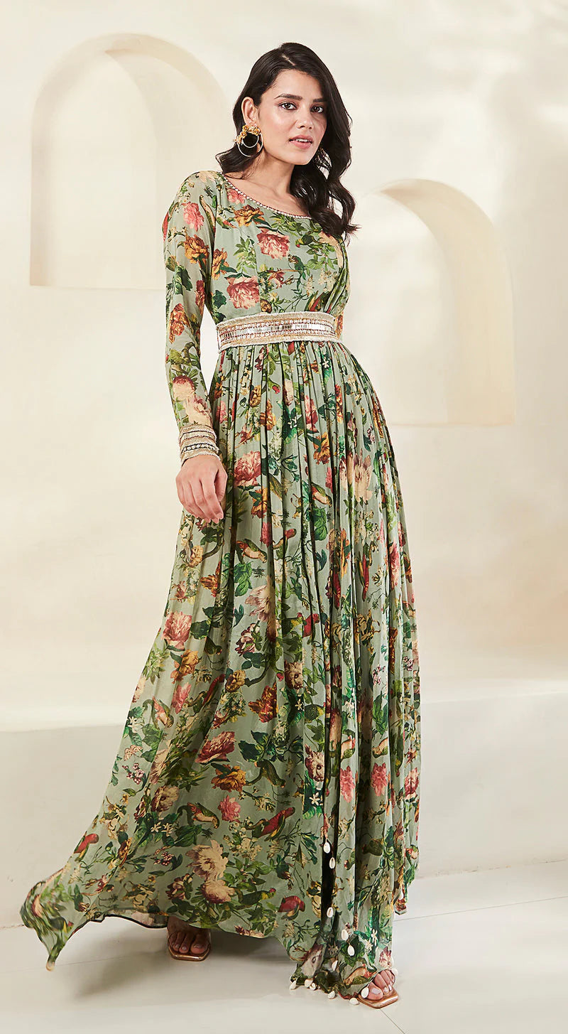 A stylish gown with a green base and floral print.
