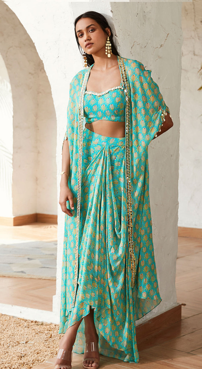 A stylish firozi georgette set with a cape.