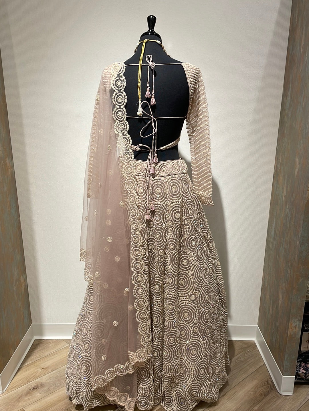 Magnificent heavy pearl lehenga with backless choli