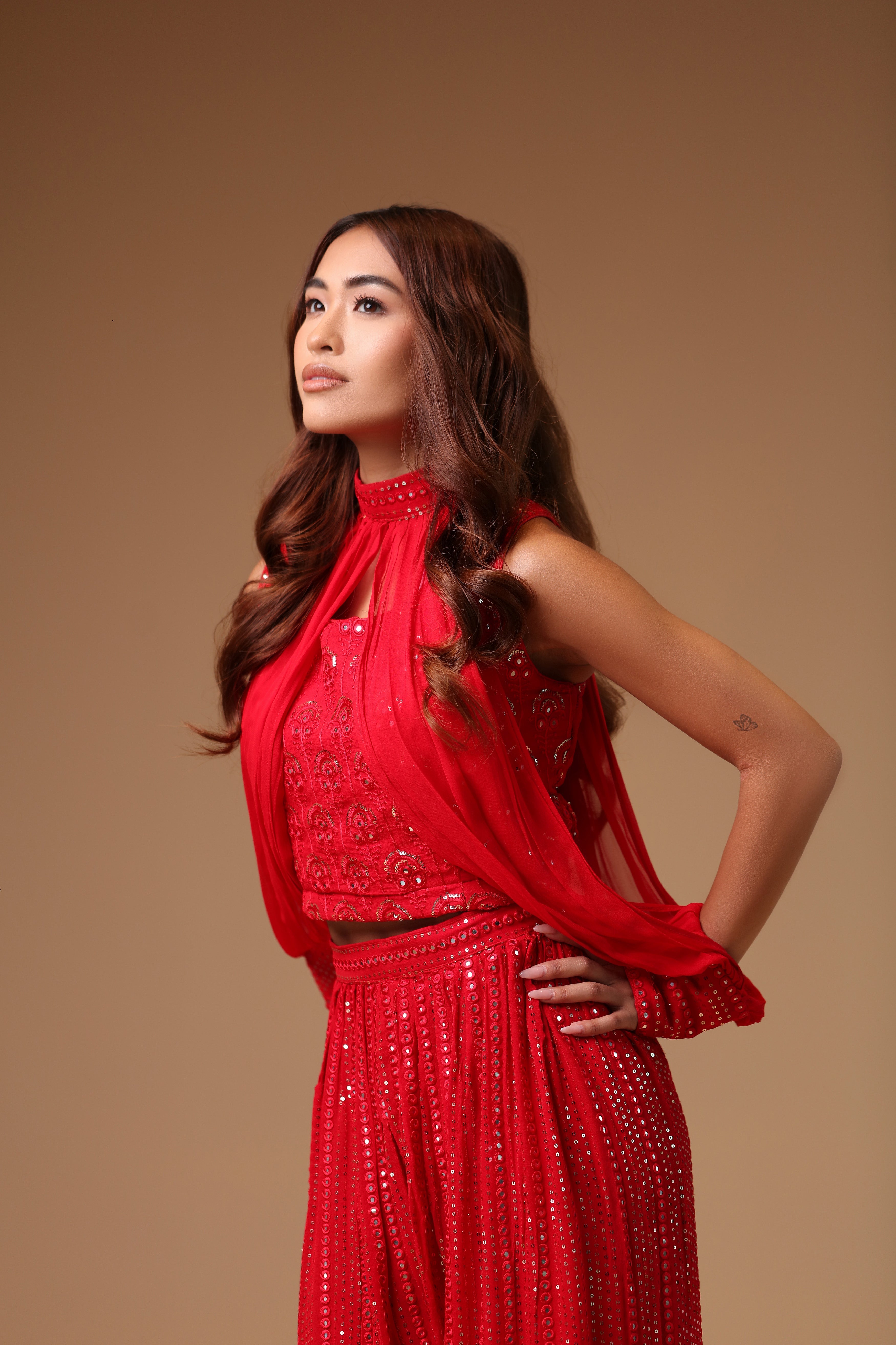 Sultry Ensemble Featuring A Red Sharara With Crop Top And Slit Sleeves