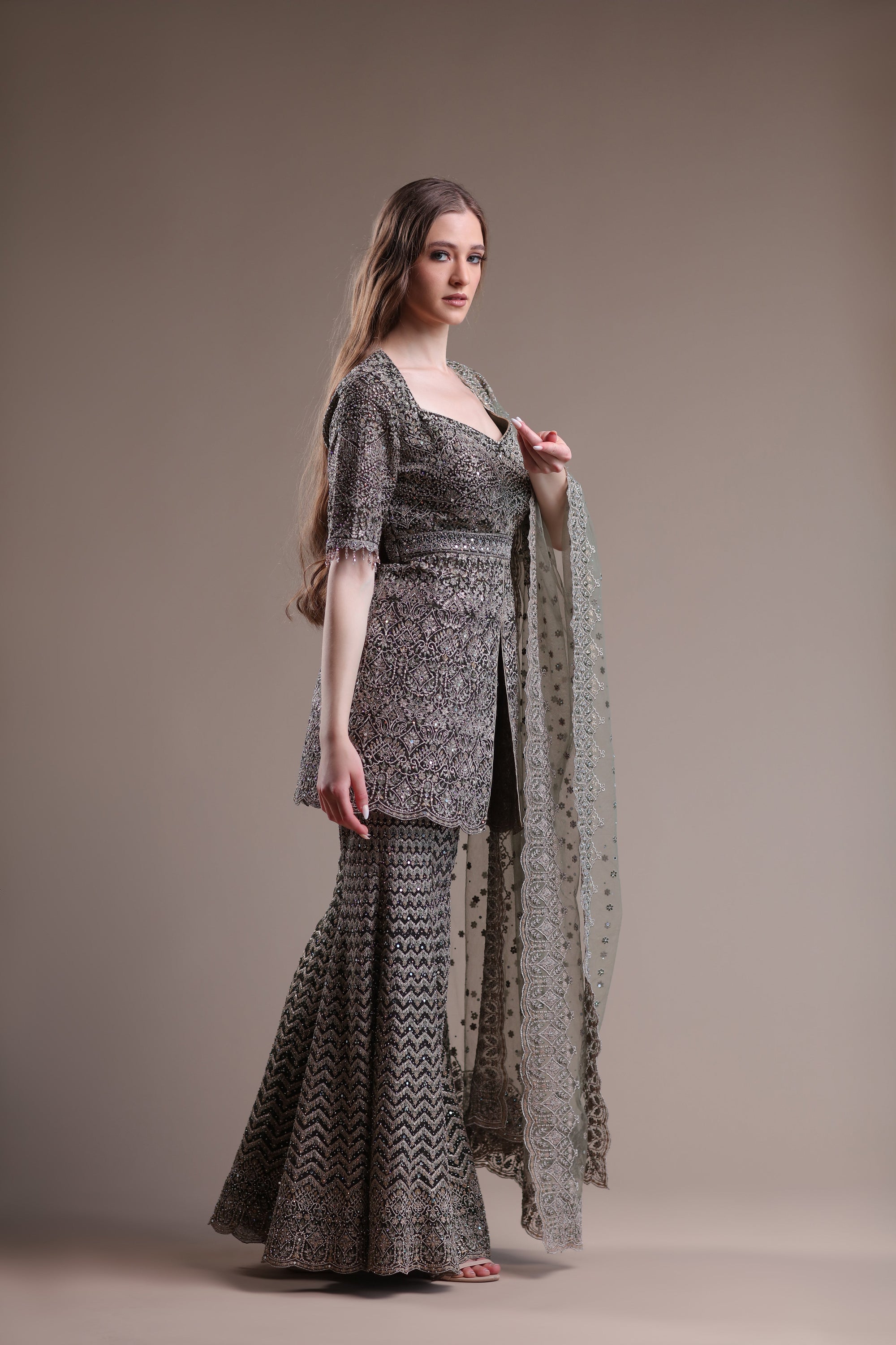 Luxurious Grey Ensemble Featuring An Embellished Sharara And Kameez