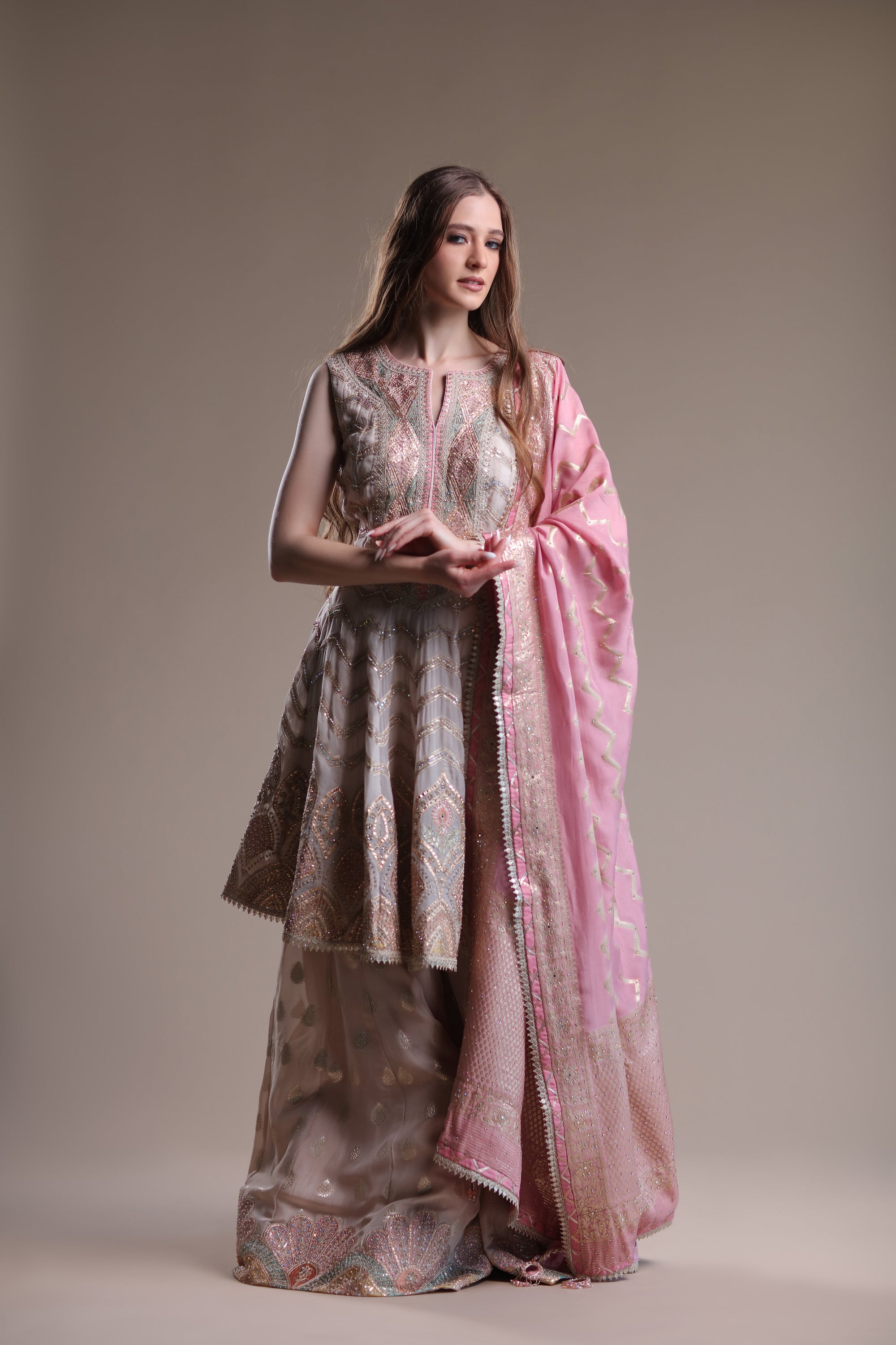 Cheeky Banarasi Ensemble Featuring Peplum sharara suit