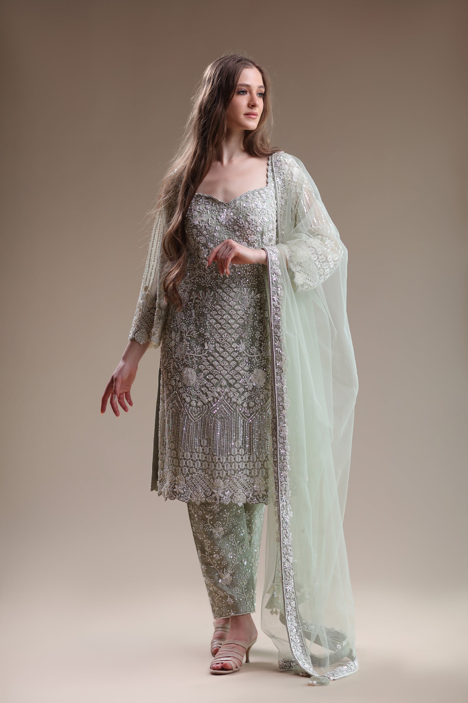 Chic Pastel Ensemble Featuring Embellished Kameez And Trousers