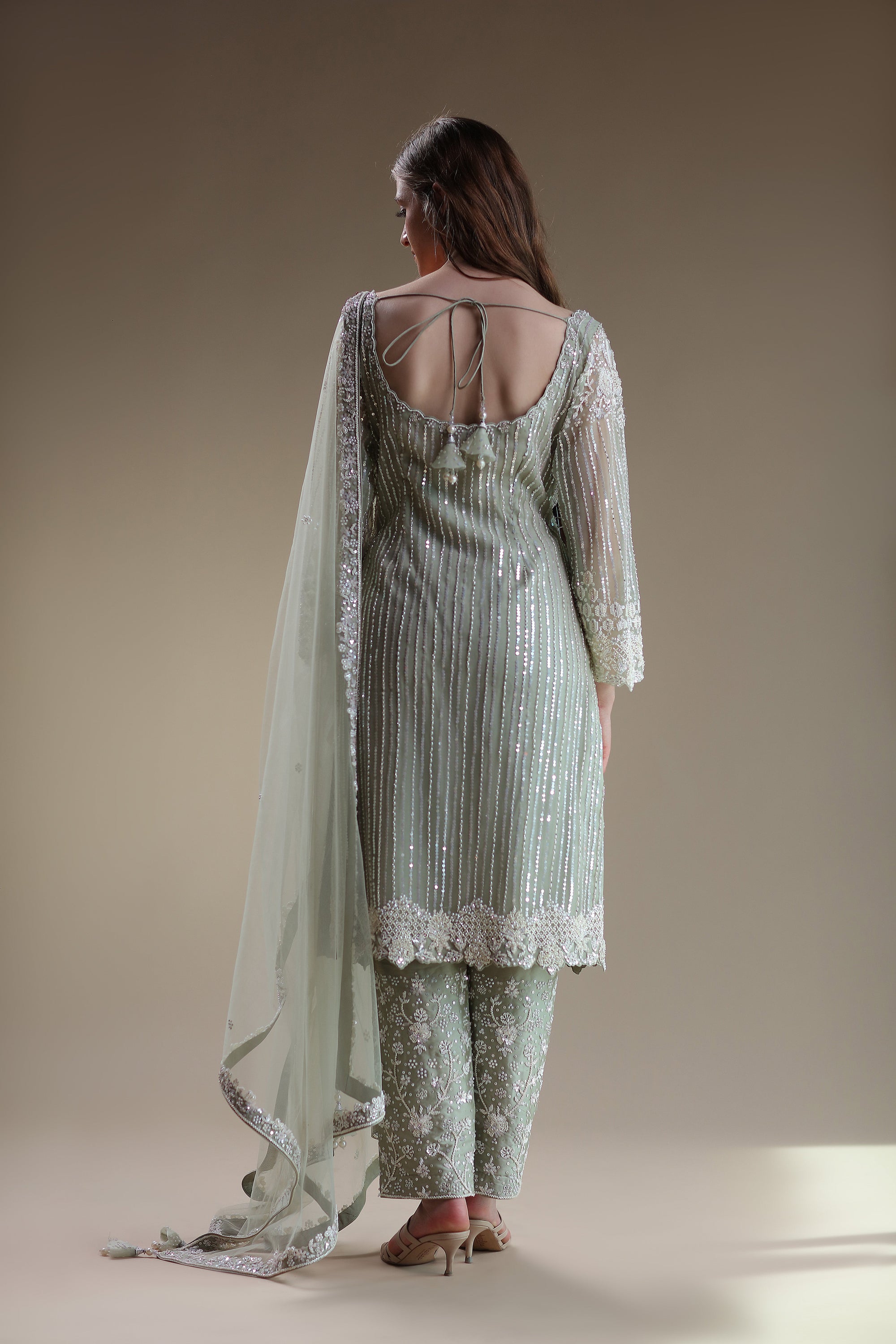 Chic Pastel Ensemble Featuring Embellished Kameez And Trousers