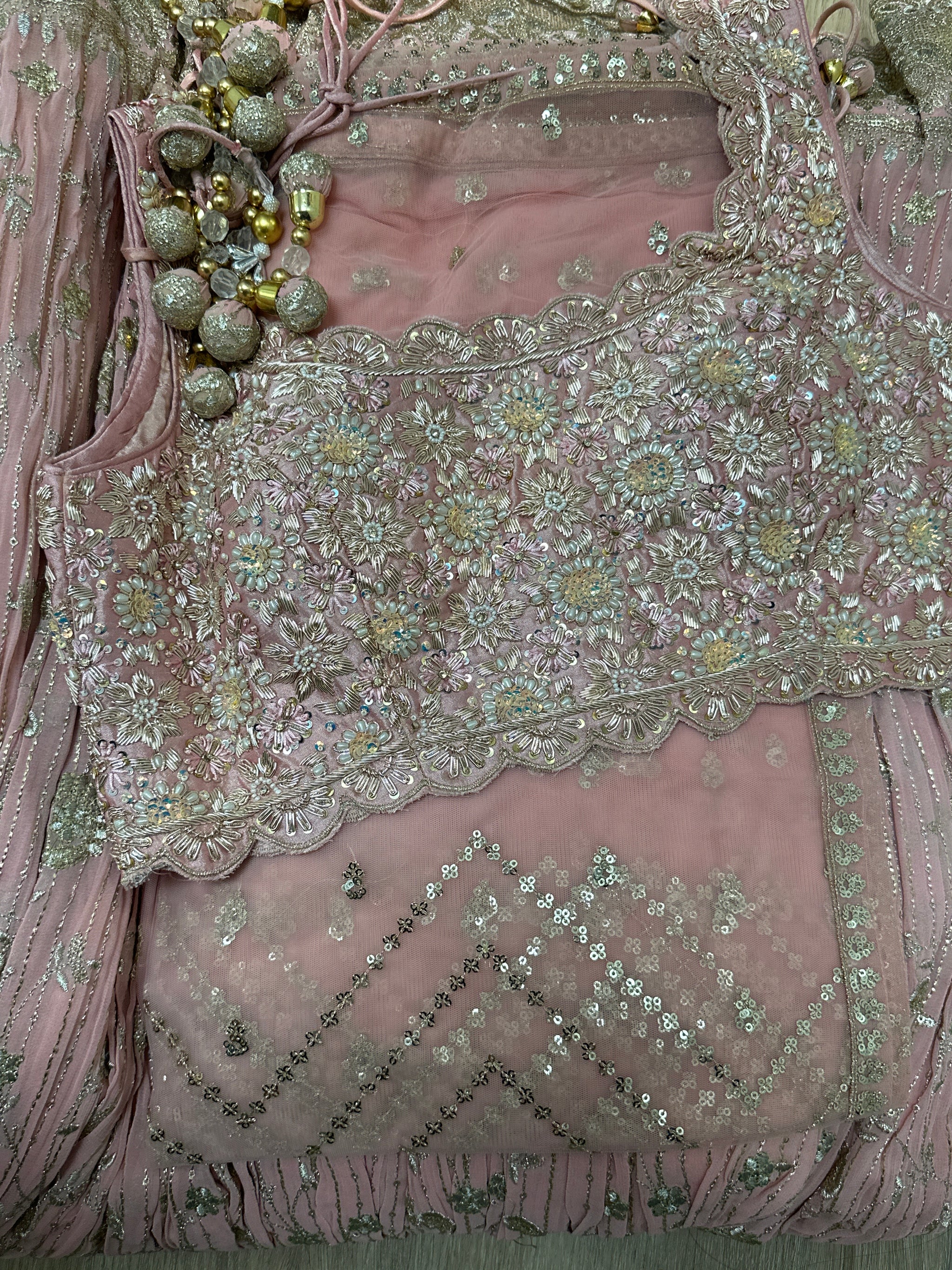 Dazzling Blouse With Detailed Lehenga