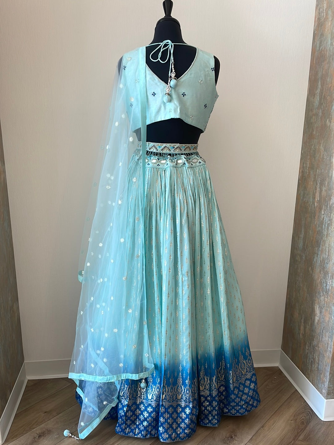 Ombre lehenga with belt attached to embellished choli