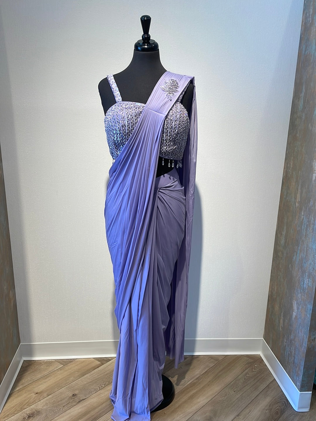 Classic drape saree with silver embroidered strappy blouse