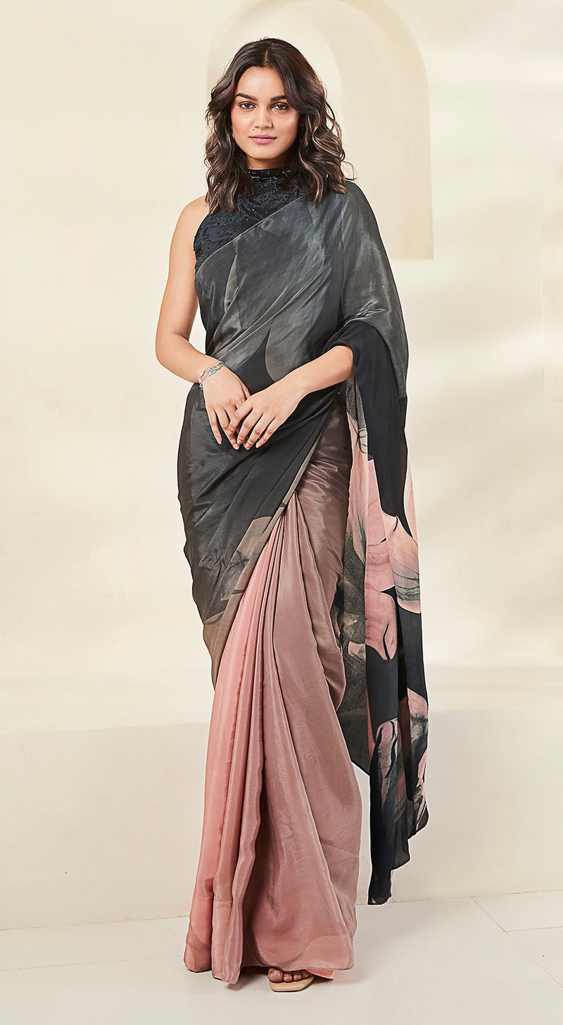 Image of a black crepe saree with pink embellishments.
