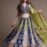 A woman posing in a stunning metallic lehenga.