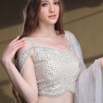 Model is wearing Beautiful Snowy Lehenga And Silver Blouse.