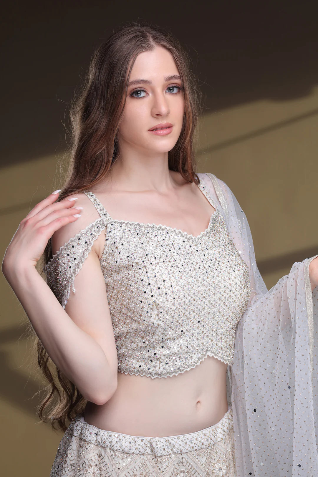 Model is wearing Beautiful Snowy Lehenga And Silver Blouse.