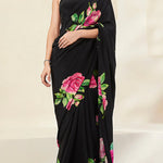 Model is wearing Black Crepe Saree with rose print.