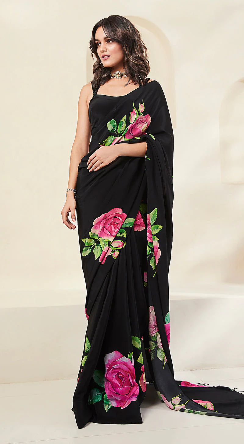 Model is wearing Black Crepe Saree with rose print.