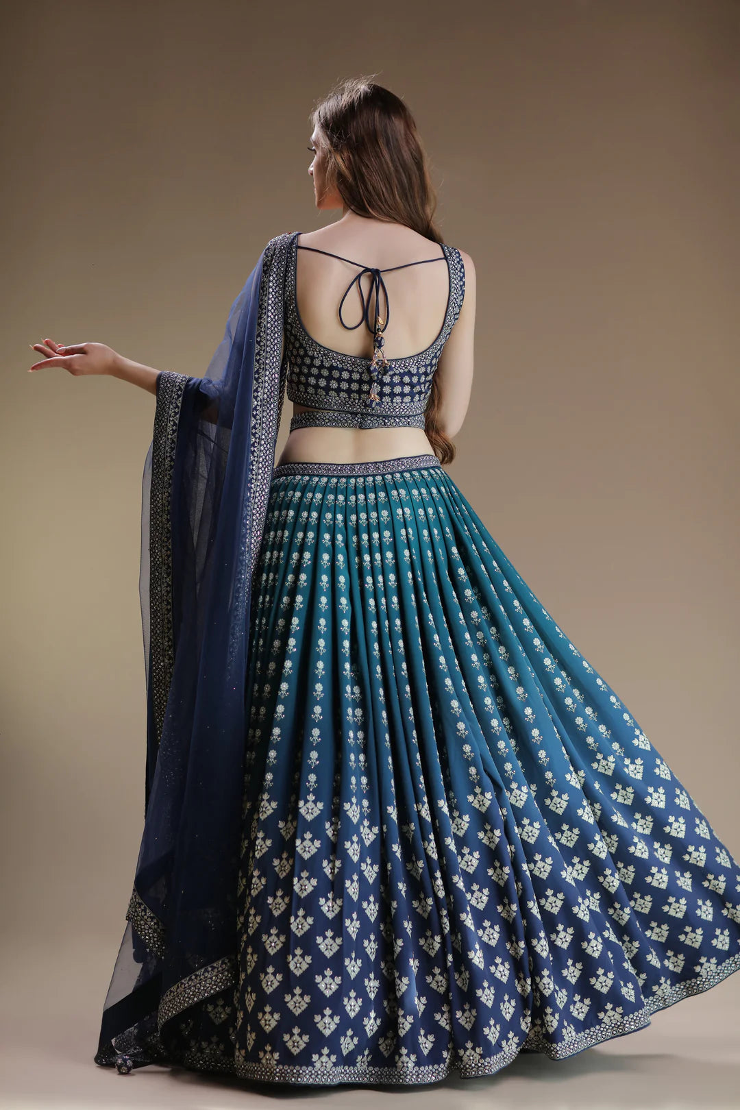 A lehenga with a cheeky cut and a navy blue color.