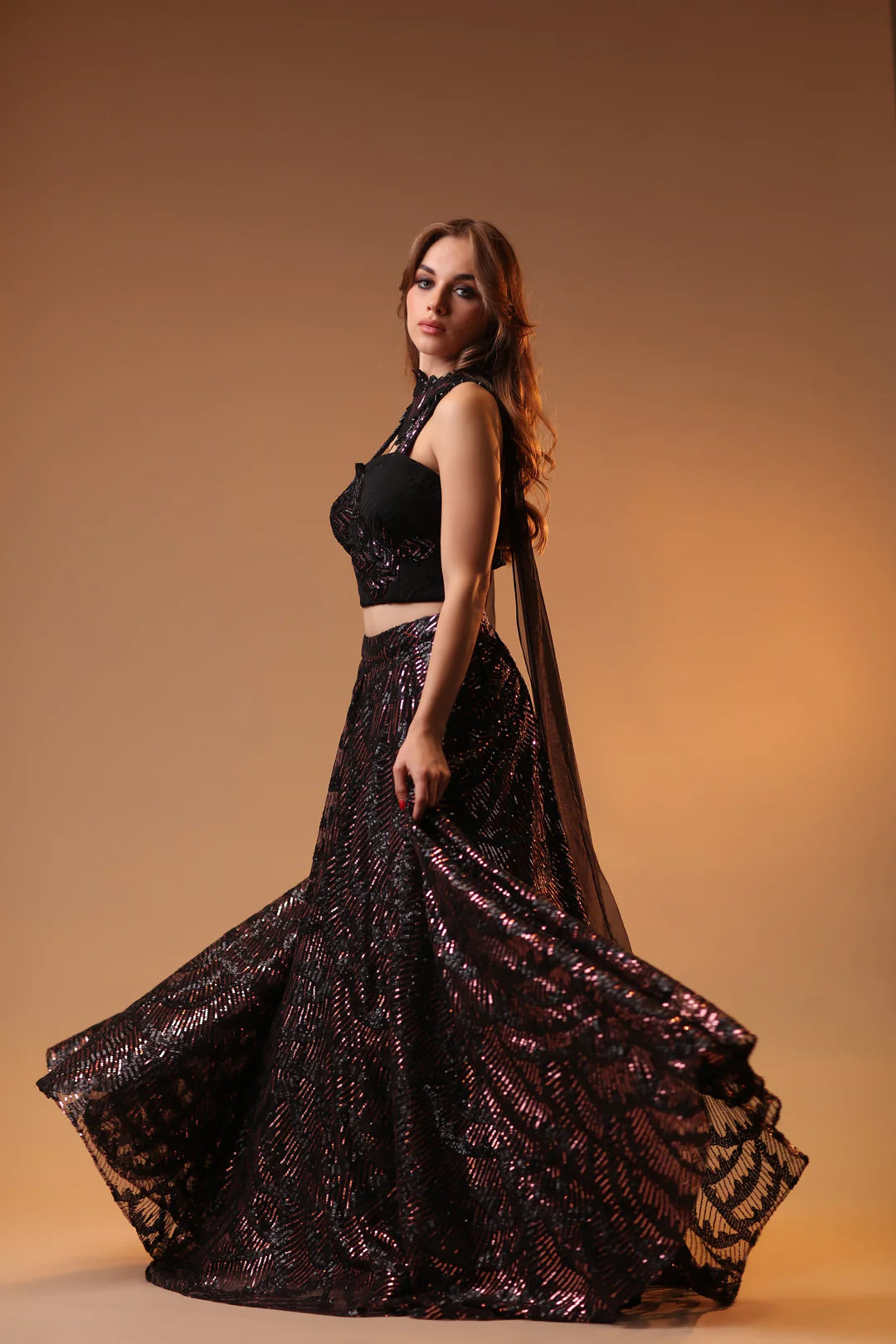 Model is wearing of a raven black lehenga.