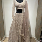 Magnificent heavy pearl lehenga with backless choli