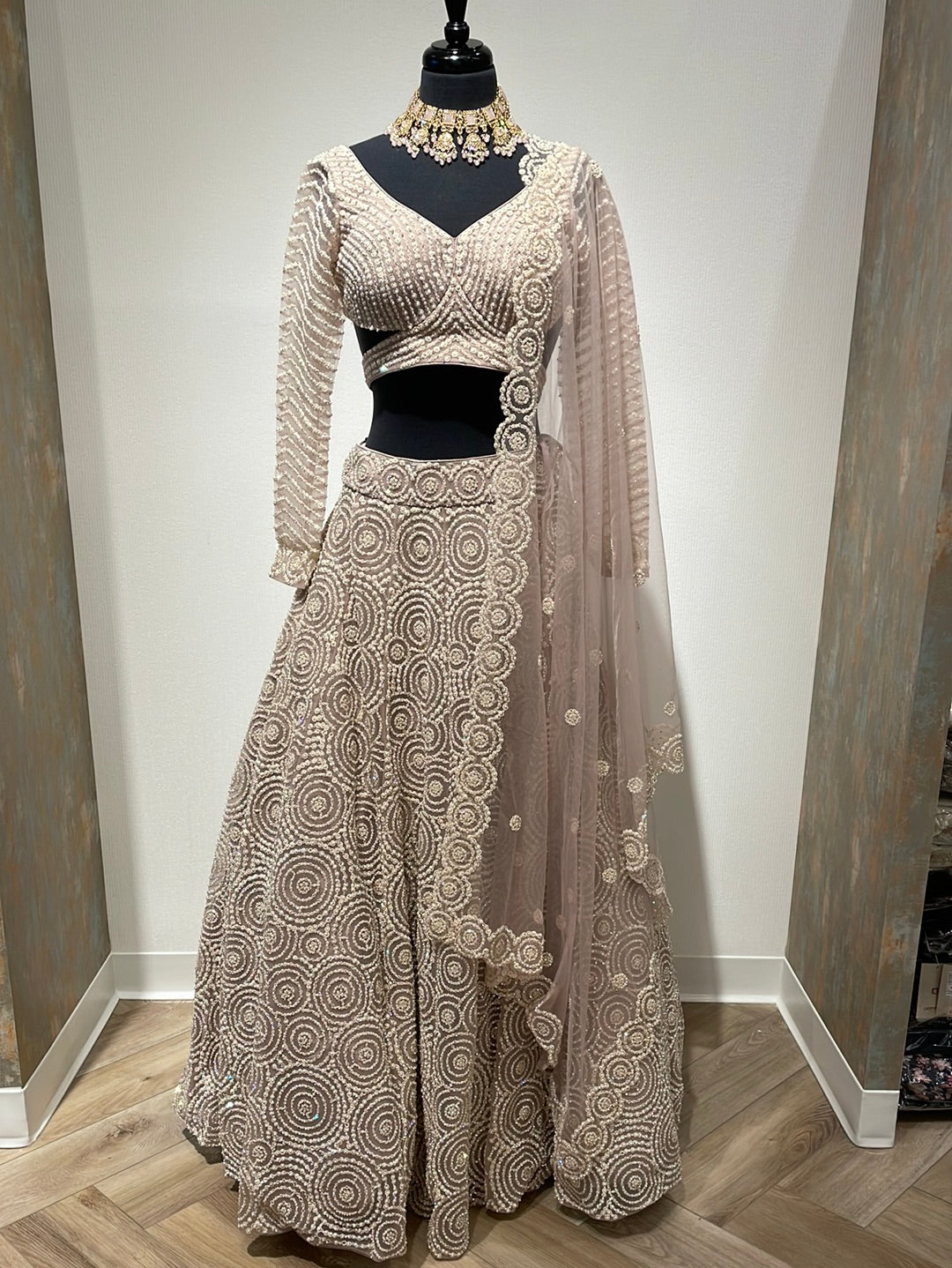 Magnificent heavy pearl lehenga with backless choli