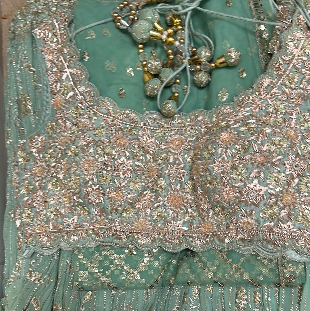 Dazzling Blouse With Detailed Lehenga