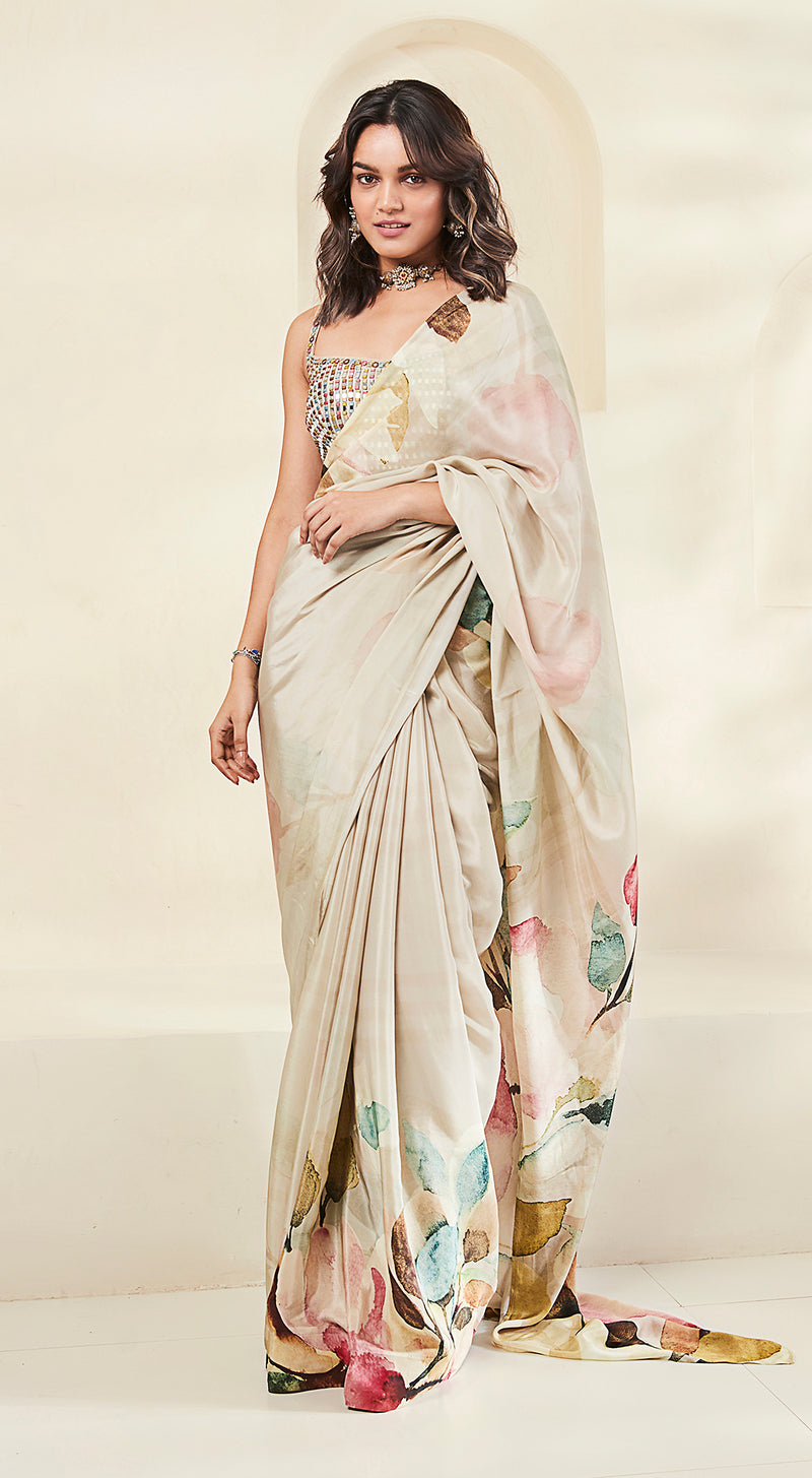 Image of a model wearing Beige Crepe Printed & Embroidered Saree.