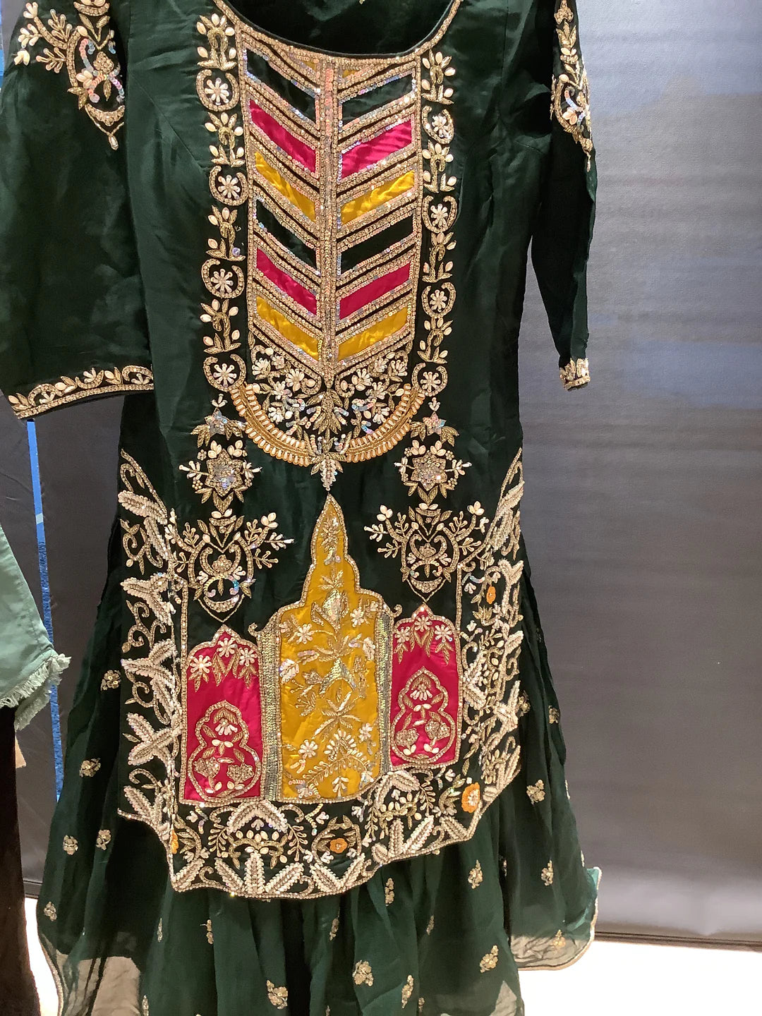 heavily embroidered green gharara outfit.