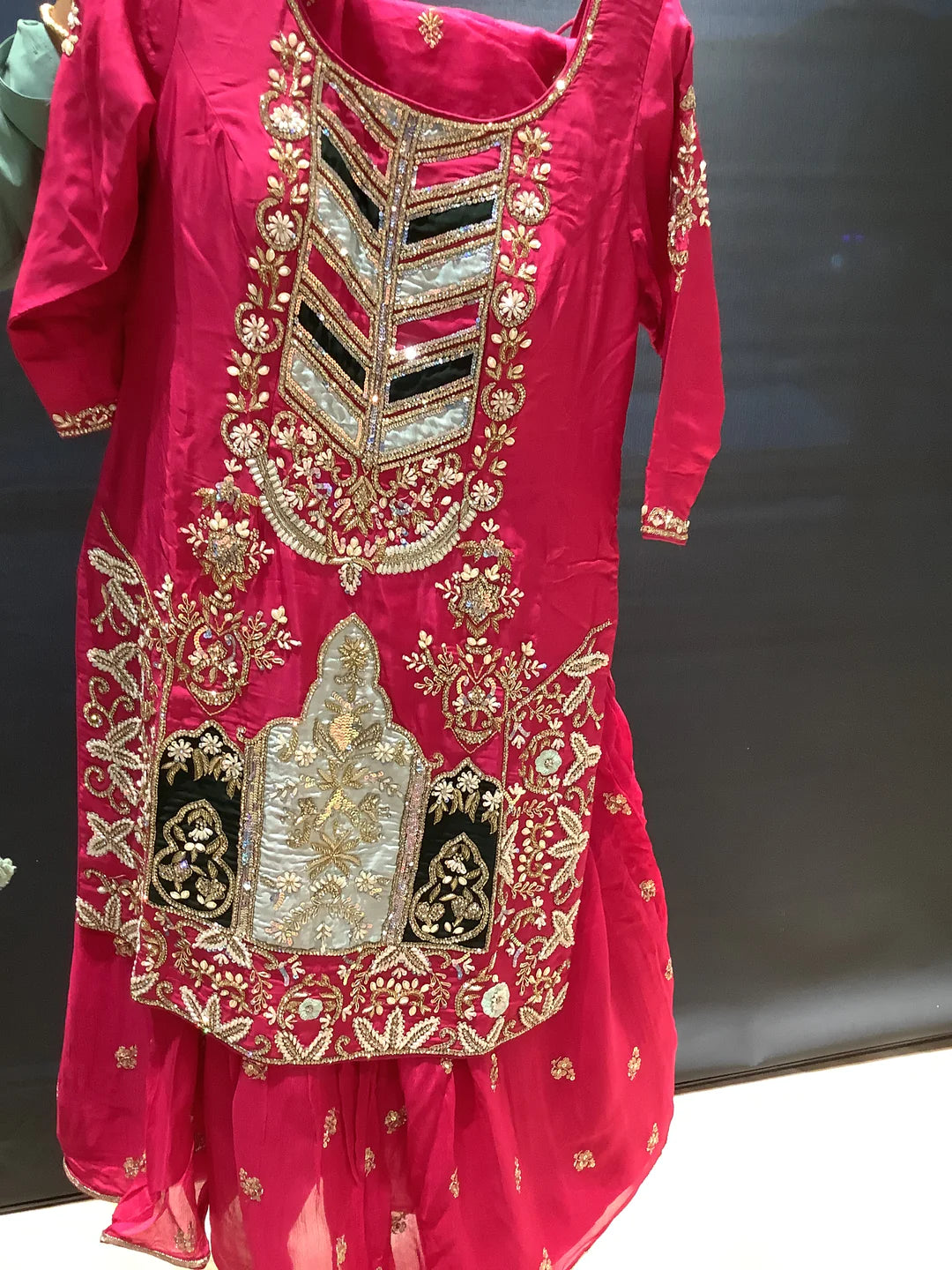 heavily embroidered hot pink gharara outfit.