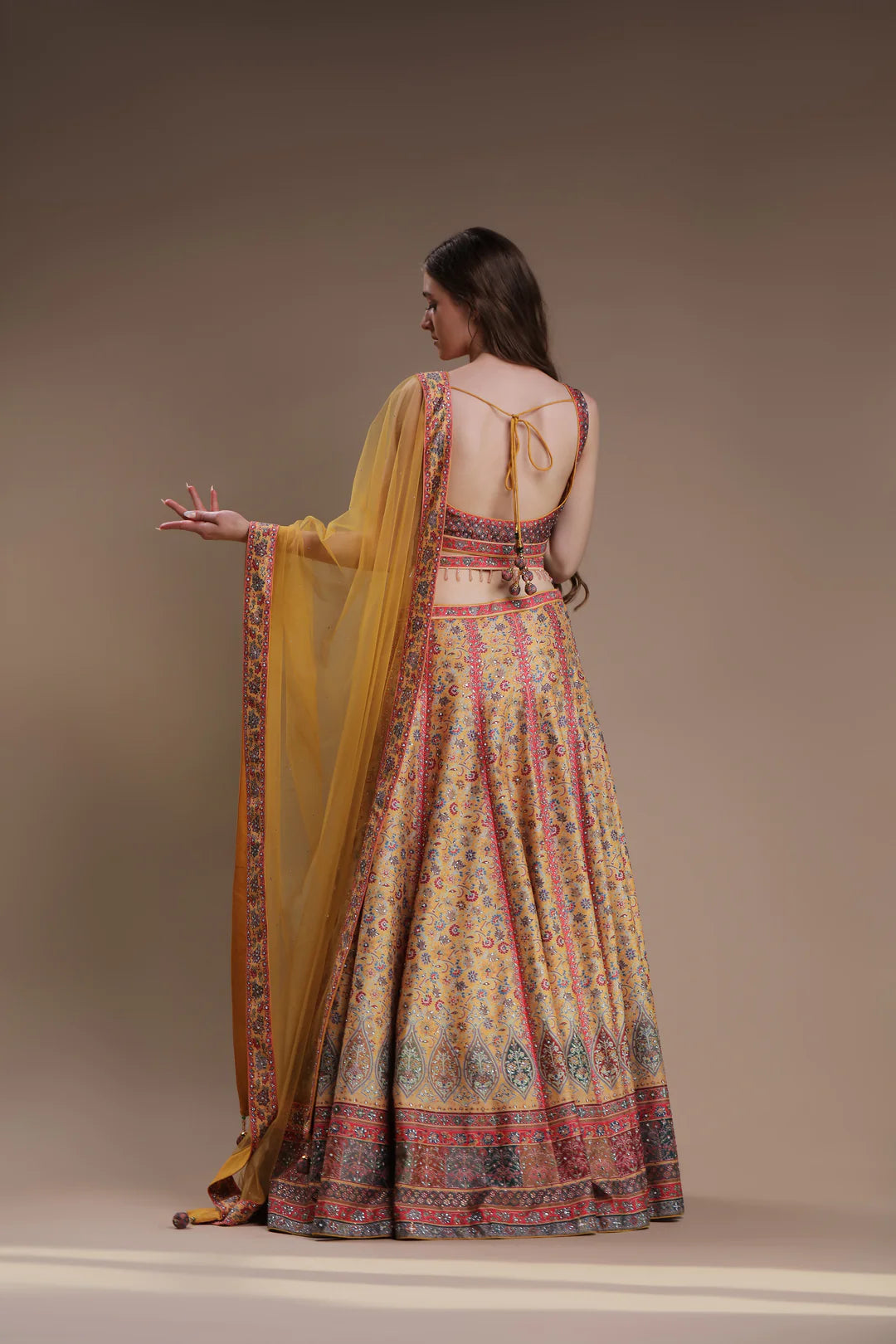 The model showcases a stylish floral lehenga with style.
