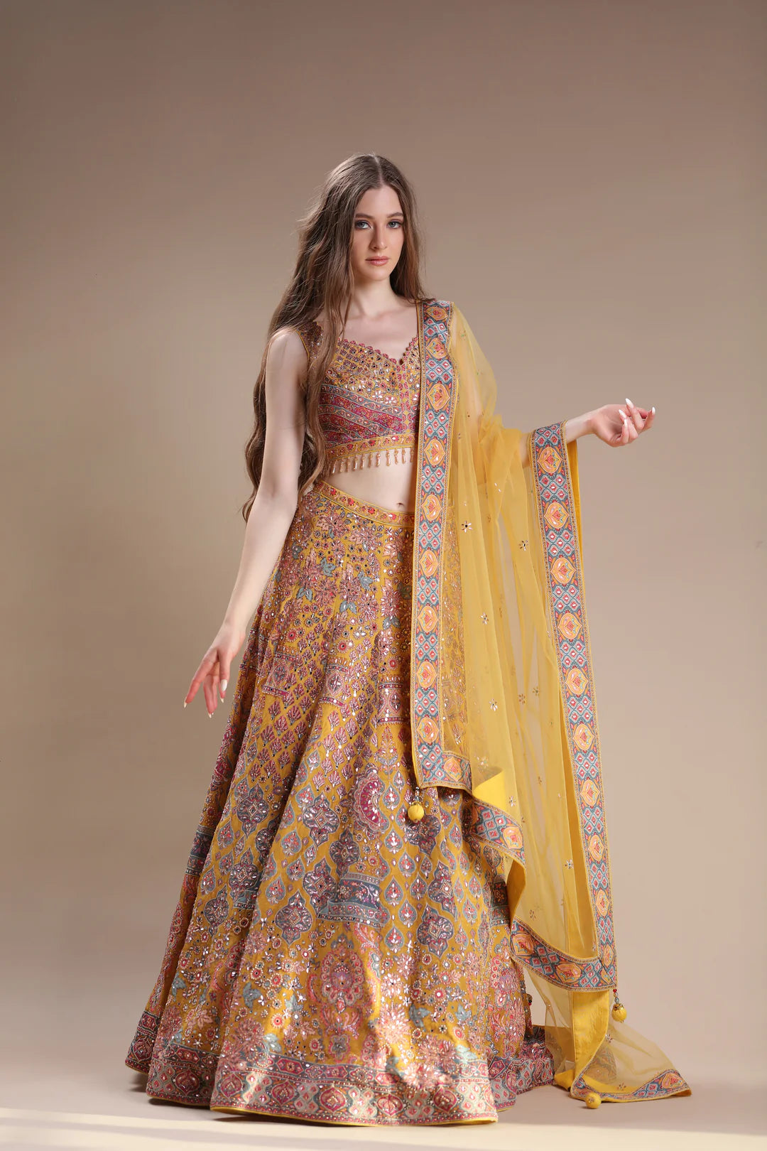 The ensemble worn by the model features a fashionable floral-patterned lehenga.